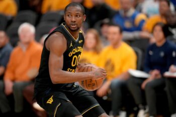 Jonathan Kuminga dribbles Warriors